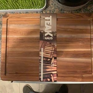 TEAK cutting board. Dimensions- 15.75x11x0.55
